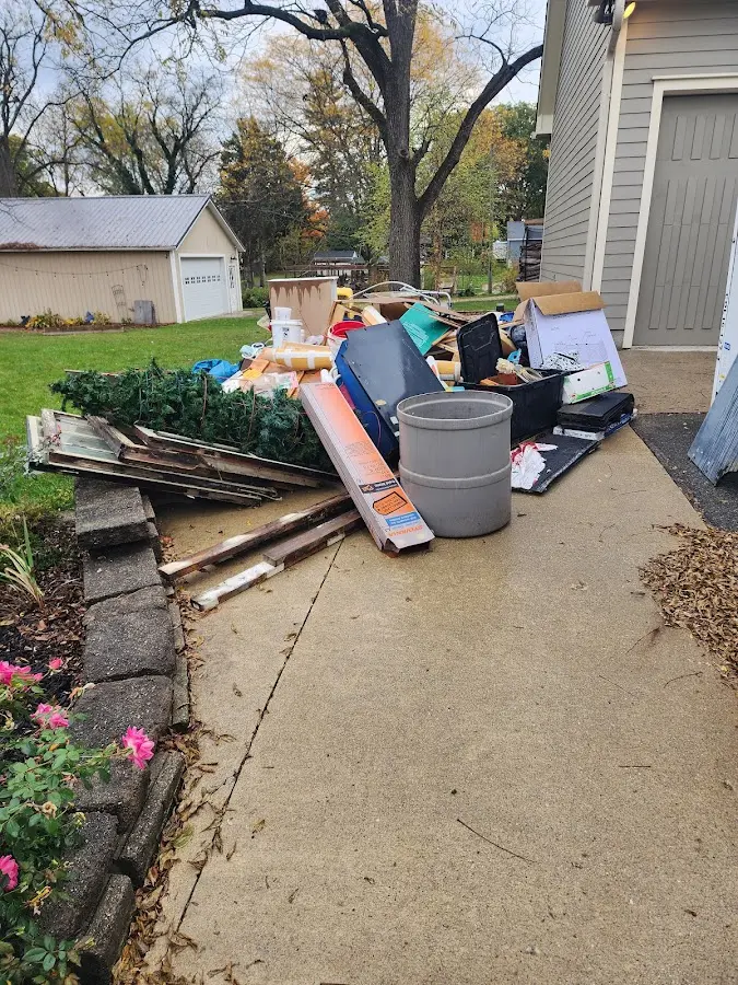 Dumpster being loaded with debris for 30 Yard Dumpster Rental in Morristown